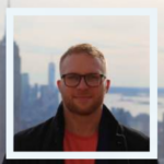 Photo of someone standing in front of city
