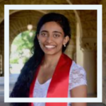 Photo of person smiling wearing red sash