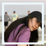 Photo of person wearing baseball cap at beach