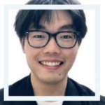 Photo of a person wearing glasses smiling